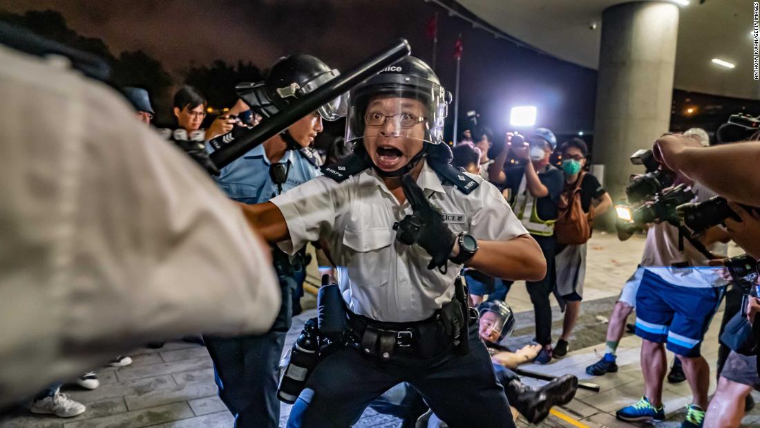 Police officers charge toward protesters during clashes on Monday, June 10. It was a continuation of protests that started the day before.