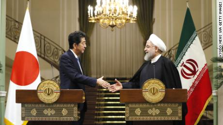 Japanese Prime Minister Shinzo Abe, left, and Iranian President Hassan Rouhani shake hands after a joint press conference in Tehran.