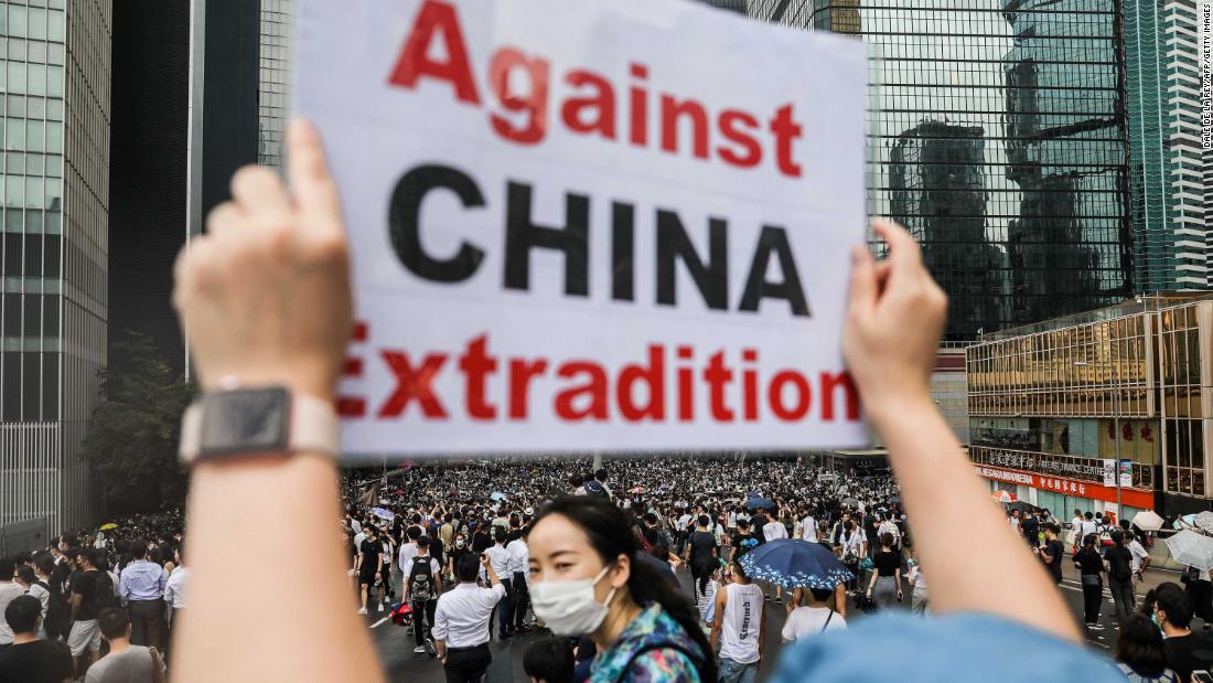 A demonstrator holds a sign during the June 12 rally.