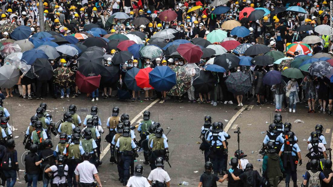 Protesters face off with police during the rally on June 12.