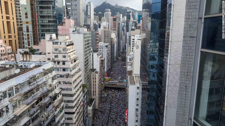 Protesters march during a rally against a controversial extradition law proposal in Hong Kong on June 9, 2019. (Photo by DALE DE LA REY / AFP) 