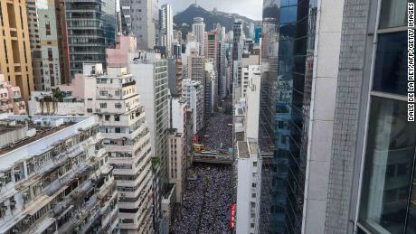 Protesters march during a rally against a controversial extradition law proposal in Hong Kong on June 9, 2019. (Photo by DALE DE LA REY / AFP) 