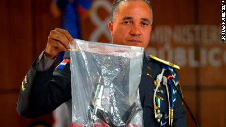 Dominican National Police Director Ney Aldrin Bautista Almonte show the gun used in the shooting of former Boston Red Sox star David Ortiz on Wednesday.