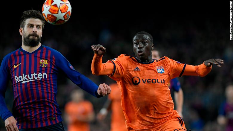 Ferland Mendy competes for the ball against Barcelona&#39;s Gerard Pique.