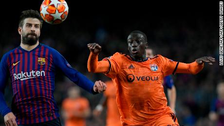 Ferland Mendy competes for the ball against Barcelona&#39;s Gerard Pique.