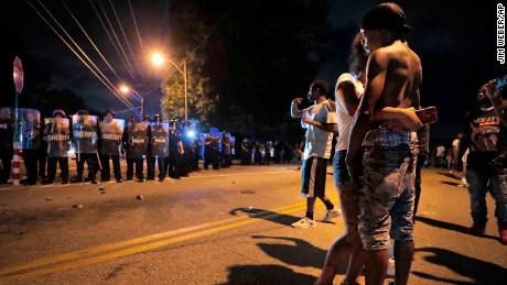 A man identified as Sonny Webber, right, the father of Brandon Webber, who was shot by US Marshals, joins a standoff as protesters take to the streets after the shooting in Memphis.