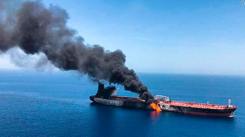 An oil tanker on fire near the strategic Strait of Hormuz on Thursday, June 13, 2019.