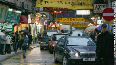 Banners on Lee Tung Street protest the redevelopment of the road known for being home to wedding banquet invitation card printers in February 2004. 