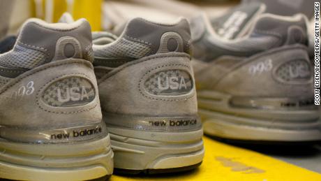 Finished sneakers wait to be packaged in the New Balance Athletic Shoe, Inc. factory in Lawrence, Massachusetts, U.S. on Friday, Dec. 16, 2011. A shoe that would take about 20 minutes to make in Asia takes two and half minutes to make in the U.S., according to New Balance Chief Executive Officer Robert DeMartini. "The way we make shoes in the U.S. delivers the same or higher quality at a much lower labor content rate, " he said in September. Photographer: Scott Eisen/Bloomberg via Getty Images