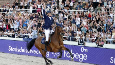 Peder Fredricson celebrates after winning the inaugural LGCT in the Olympic Stadium in Stockholm.