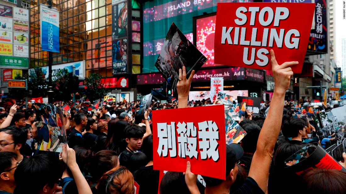 Many of those attending the rally on June 16 carried signs with the slogan &quot;stop killing us&quot; alongside images of bloodied protesters.