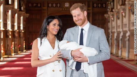 The Sussexes with their newborn son Archie Harrison Mountbatten-Windsor during a photocall in St George&#39;s Hall at Windsor Castle on May 8, 2019. 