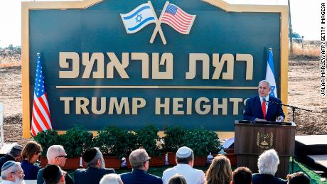 Netanyahu unveils the &quot;Trump Heights&quot; sign at a proposed settlement site.