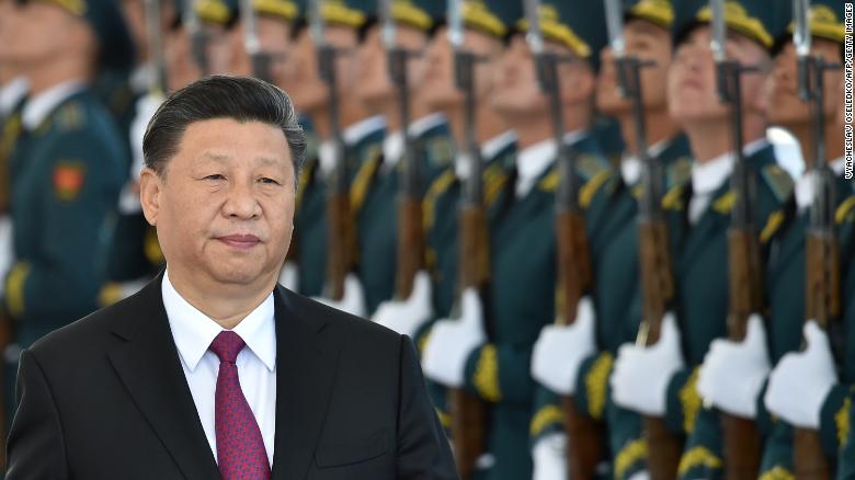 Chinese President Xi Jinping walks past honour guards during a welcoming ceremony prior to the talks with his Kyrgyz counterpart in Bishkek on June 13.