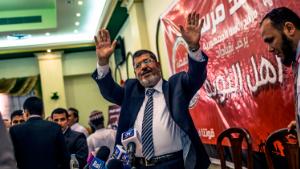 CAIRO, EGYPT - JUNE 13: Egyptian presidential candidate Mohamed Morsi of the Muslim Brotherhood addresses suporters at a press conference on June 13, 2012 in Cairo, Egypt.  Egyptian candidates Mohamed Morsi and Ahmed Shafiq are pegged against each other in the second round of voting for the country's president to be held on the 16th and 17th of June. (Photo by Daniel Berehulak/Getty Images)