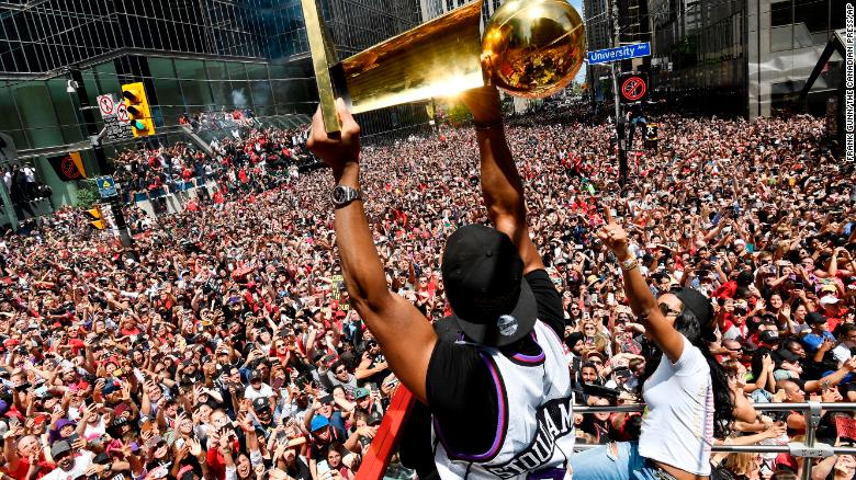 The Toronto Raptors celebrate their first NBA championship with fans Monday.