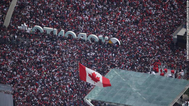 Fans gather at Nathan Phillips Square for the Toronto Raptors&#39; NBA Championship Victory Parade.