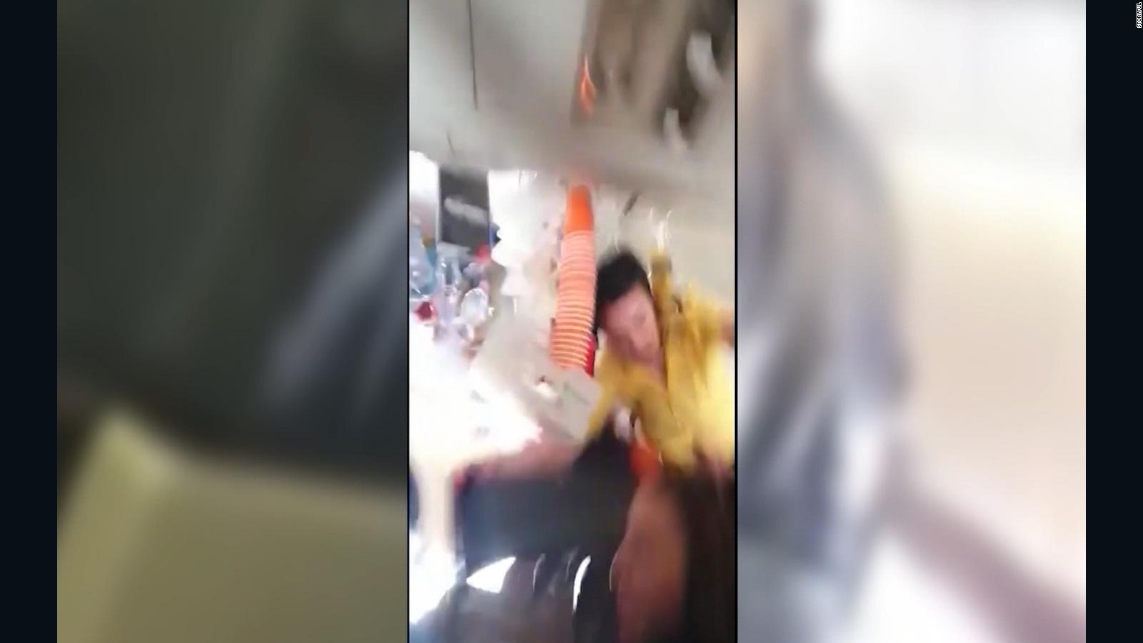 Violent Turbulence Throws Flight Attendant Into Ceiling - CNN Video