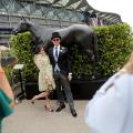 Royal Ascot 2019 racegoers pose horse statue