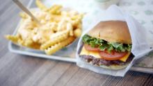 A ShackBurger, cheese fries, and milkshake are arranged for a photograph at a Shake Shack Inc. restaurant in Lexington, Kentucky, U.S., on Wednesday, March 6, 2019. Shake Shack is still failing to bring in more diners as it expands outside its home market of New York in the fiercely competitive restaurant space -- the chain plans to open 36 to 40 company-owned U.S. locations in fiscal 2019. Photographer: Luke Sharrett/Bloomberg via Getty Images