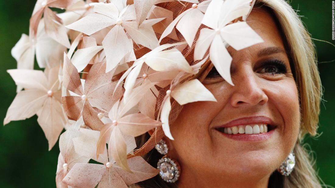 Queen Maxima is full of smiles as she waved to racegoers.