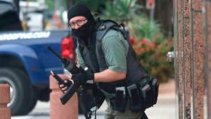 An armed shooter (shown) attacks at the Earle Cabell federal courthouse Monday morning, June 17, 2019 at the in downtown Dallas. Law enforcement returned fire and the shooter was hit by gunfire. No officers or citizens were injured. (Tom Fox/The Dallas Morning News) - 