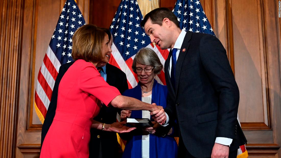 Moulton shakes hands with House Speaker Nancy Pelosi during his ceremonial swearing-in this year. Moulton in the past has tried to oust Pelosi from House Democratic leadership. But this time, he voted for her speakership.