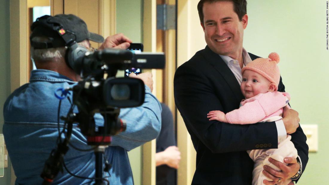 Moulton holds his daughter, Emmy, before a town-hall event in Newburyport, Massachusetts, in May 2019. Emmy is his only child.