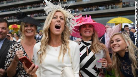 Racegoers cheer on the horses on day two of Royal Ascot.