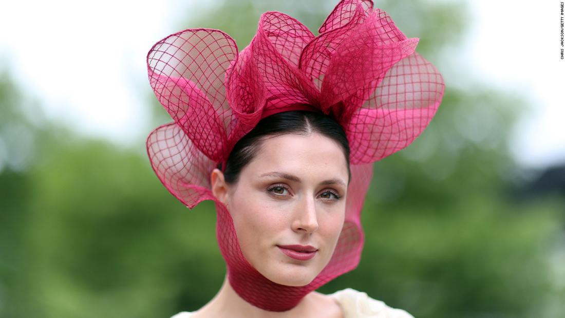 Entrepreneur Valerie Stark in an intricate maroon headpiece. 