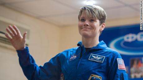 Expedition 58 Flight Engineer Anne McClain of NASA waves during a press conference, Sunday, Dec. 2, 2018 at the Cosmonaut Hotel in Baikonur, Kazakhstan. Launch of the Soyuz rocket is scheduled for Dec. 3 and will carry McClain, Soyuz Commander Oleg Kononenko of Roscosmos, and David Saint-Jacques of the Canadian Space Agency (CSA) into orbit to begin their six and a half month mission on the International Space Station. Photo Credit: (NASA/Aubrey Gemignani).