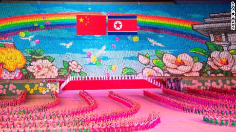 Chinese and North Korean flags are displayed during a mass gymnastic performance at the May Day Stadium in Pyongyang, North Korea.