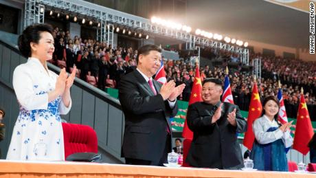 Xi Jinping, second from left, and his wife Peng Liyuan, left, and Kim Jong Un, second from right, and his wife Ri Sol Ju, right, in Pyongyang, North Korea.