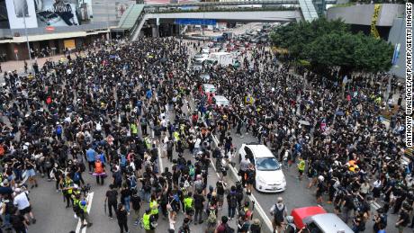 Protesters occupy a main road outside the government headquarters in Hong Kong on June 21, 2019.