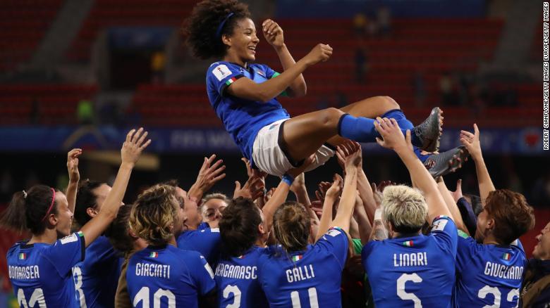 Sara Gama of Italy is thrown in the air by her teammates.