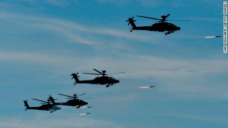 Four US-made Apache attack helicopters launch missiles during the 35th &quot;Han Kuang&quot; military drill in southern Taiwan on May 30.