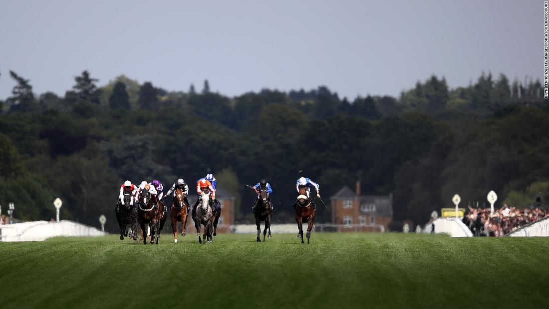 Frankie Dettori riding Advertise leads the field on the run-in in the Commonwealth Cup.