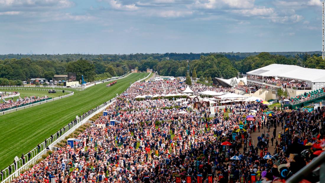 Huge crowds once again pack the historic race course in Berkshire, west of London.  