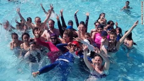 French Muslim women wear burkinis in the pool as a protest