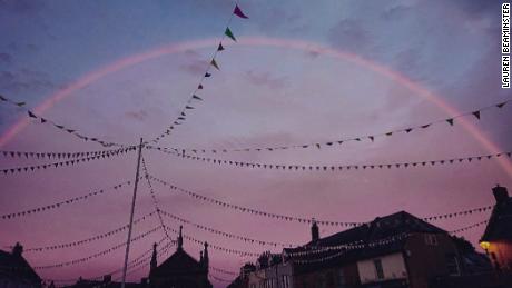 A pink rainbow appears over Dorset, England.