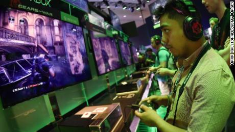 Gamer Jonathan Martinez tests a new &quot;Gears of War&quot; game at the Xbox display on the second day of the Electronic Entertainment Expo, known as E3 at the Convention Center in Los Angeles, California on June 17, 2015.  The expansive E3 show floor was rich with VR offerings from developers working on games for immersive head gear expected to hit the market in force next year.        AFP PHOTO / MARK RALSTON        (Photo credit should read MARK RALSTON/AFP/Getty Images)