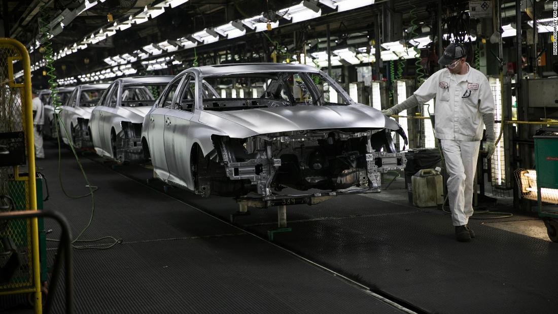 A worker inspects cars on the line in the welding department at the Honda plant in Marysville, Ohio.