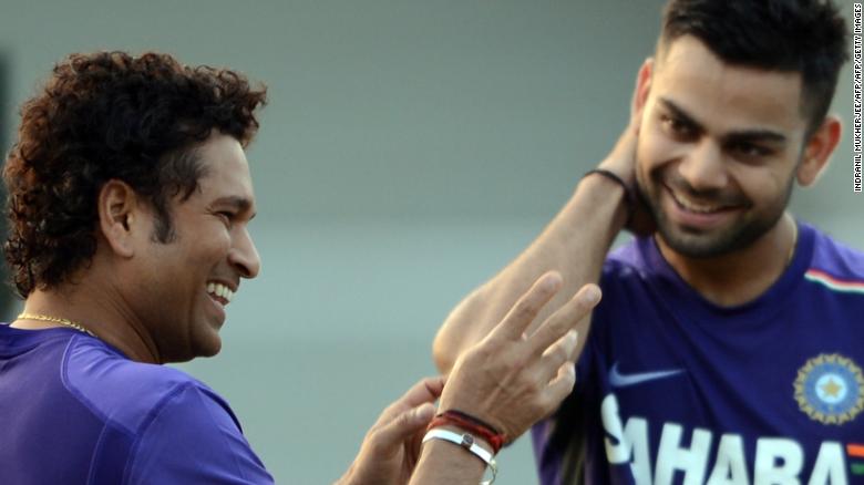 Tendulkar shares a light moment with Kohli during a training session in Mumbai on November 9, 2012. 