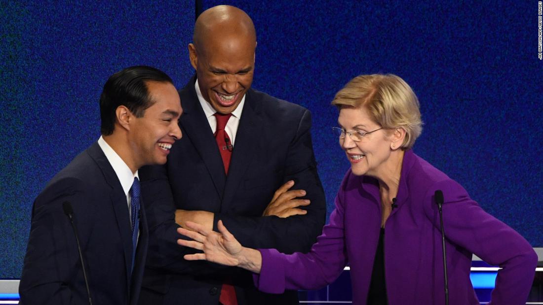 From left, Castro, Booker and Warren share a laugh during a commercial break on Wednesday.