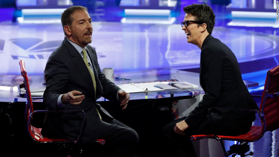 NBC moderator Chuck Todd speaks to the audience during a technical problem in Wednesday&#39;s debate. As microphone issues continued, Todd was forced to cut to a commercial break. At right is moderator Rachel Maddow.