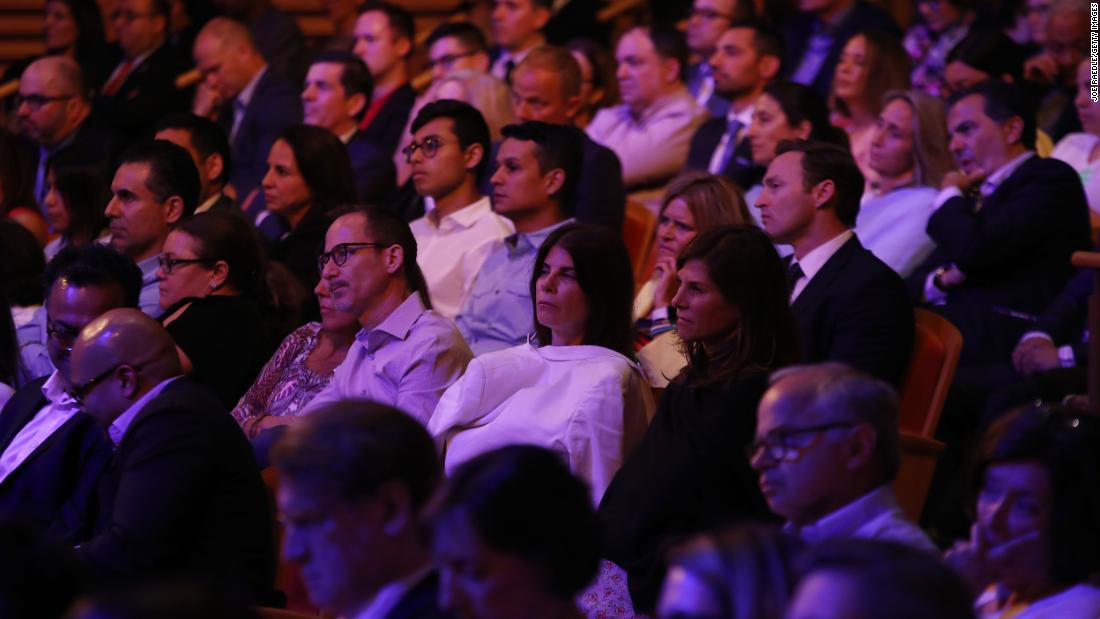 Members of the audience watch the debate Wednesday.