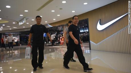 People walking out of a Nike store in Beijing last September.