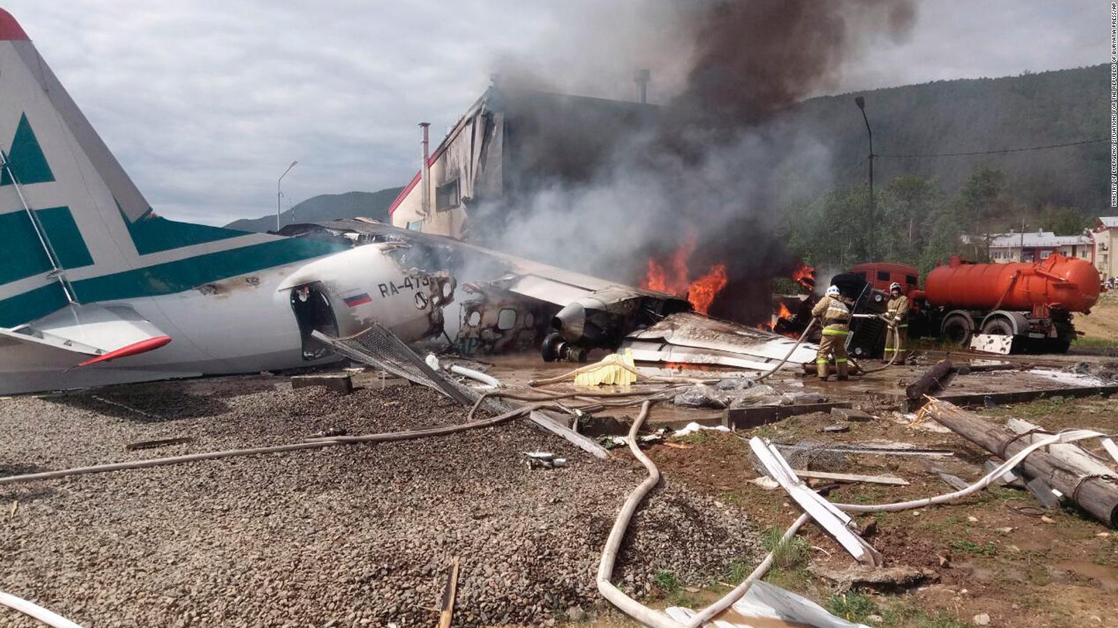 Two killed after Russian plane overshoots runway and bursts into flames ...