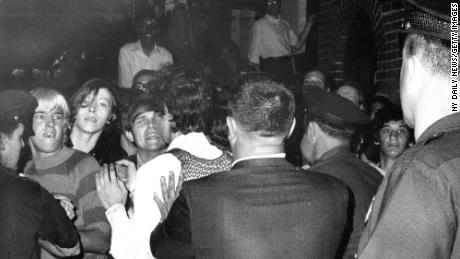 UNITED STATES - JUNE 28:  Stonewall Inn nightclub raid. Crowd attempts to impede police arrests outside the Stonewall Inn on Christopher Street in Greenwich Village.  (Photo by NY Daily News Archive via Getty Images)