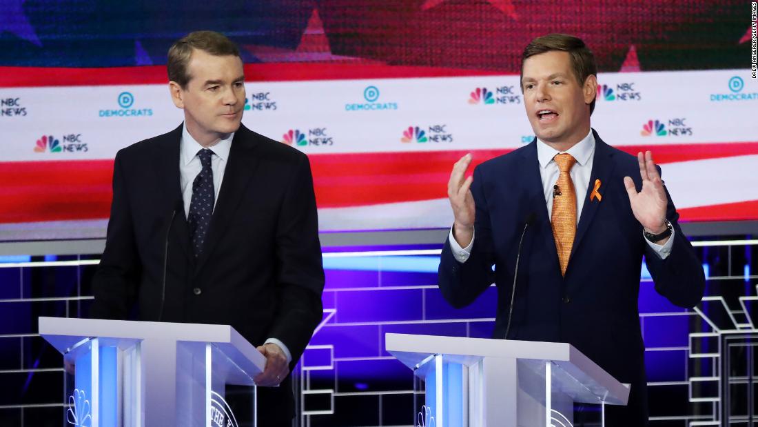 Bennet watches Swalwell speak on Thursday. Swalwell, a four-term congressman from California&#39;s Bay Area, has made combating gun violence a focus for months, and he said it will be the top focus of his campaign. &lt;a href=&quot;https://www.cnn.com/politics/live-news/democratic-debate-june-27-2019/h_37e0b86709474a8520e8329c0df8e278&quot; target=&quot;_blank&quot;&gt;The orange ribbon on his lapel&lt;/a&gt; was worn to honor the victims of the Parkland, Florida, school shooting last year.